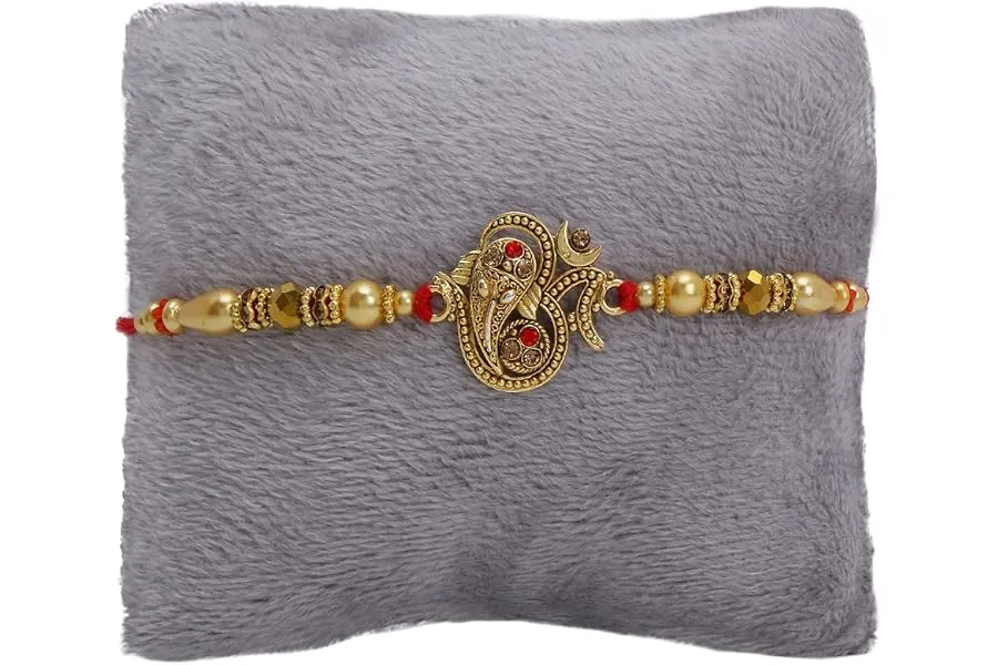 Riddhika Ventures Glorious Gold Plated Auspicious OM and Diamond Ring Rakhi with Roli Chawal an — Linkbiz SmartDeal's
